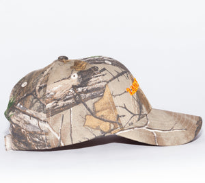 Last Supper Real Tree camo hat with orange logo and velcro back