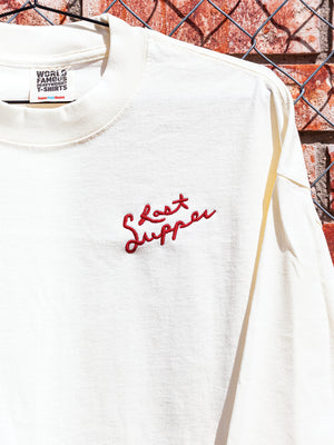 Red embroidered script logo on cream long sleeve shirt
